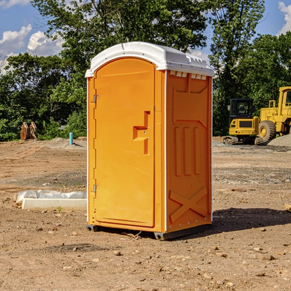 what is the cost difference between standard and deluxe portable toilet rentals in Mitchell County